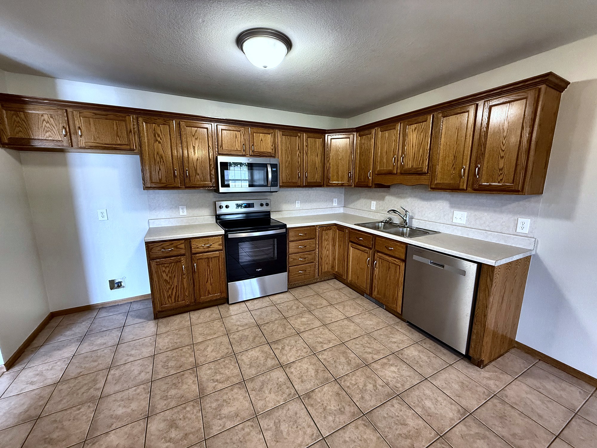 Kitchen with new stainless appliances
